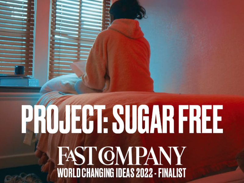 Project:SugarFree is a finalist for Fast Company World Changing Ideas. Picture is of girl sitting on a bed reading.